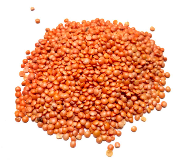 istock Red Lentils or Masoor Dal isolated on White Background 1253180639