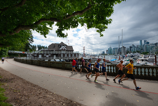 Vancouver,Canada-June 27,2020:With start of phase 3 of reopening, people of Vancouver are meeting friends and families in small groups, while mostly following the orders and guidelines of BC health officials. Here people are walking and running at Stanley park seawall on a beautiful Saturday morning.