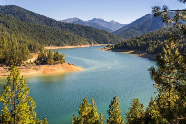 Beautiful naturally framed by pine trees landscape of the Applegate lake in Oregon, in golden hour