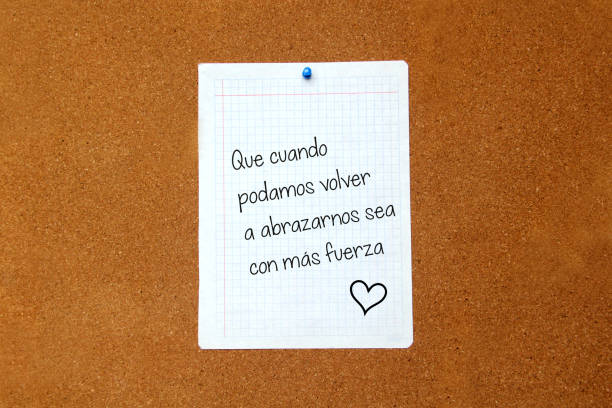 istock white note on cork board with message That when we can hug each other again it will be with more strength 1253186578