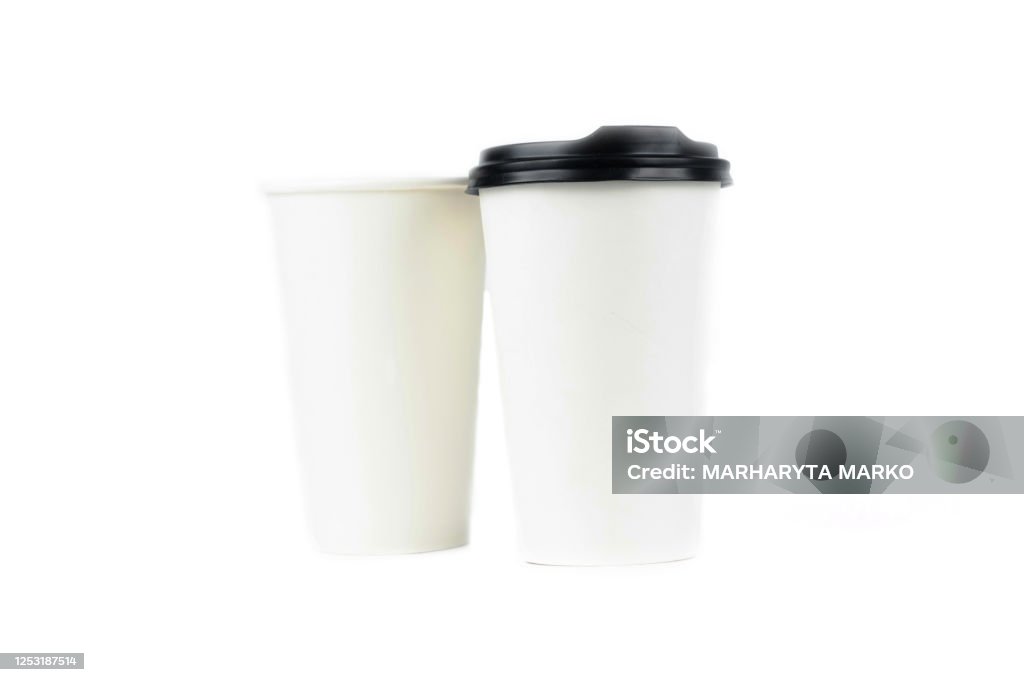 A row of paper coffee cups on a white background.Glasses for coffee and tea of different sizes isolated on white background. Hot coffee, starbucks. A row of paper coffee cups on a white background.Glasses for coffee and tea of different sizes isolated on white background. Hot coffee, starbucks Cafe Stock Photo