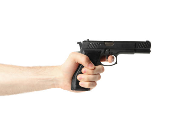istock Male hand hold black pistol, isolated on white background 1253188894