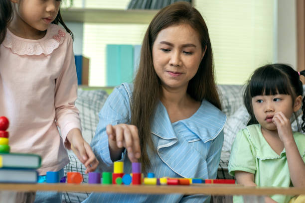 istock An Asian mother and teaching her children 1253189457