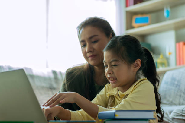 istock An Asian mother and teaching her children 1253190667