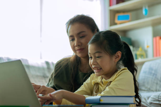 istock An Asian mother and teaching her children 1253190798