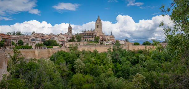Panoramic view of Segovia cityscape, with clear blue sky and some clouds, Spain