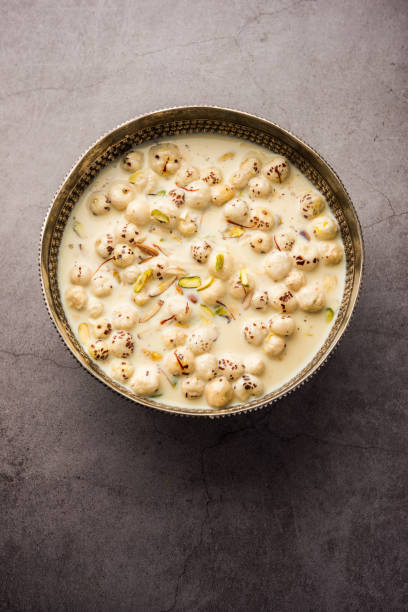 Sweet Roasted Makhana Kheer is an Indian dessert recipe, served in a bowl garnished with dry fruits stock photo
