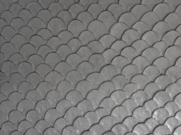 istock Gray fish scale mortar plaster pattern of wallpaper in vintage style 1253192820