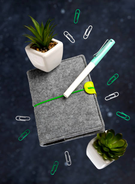 Office supplies stationery levitate over black background. Back to school work education creative layout