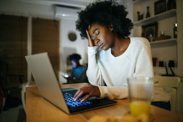 istock Woman works from home late at night 1253196373
