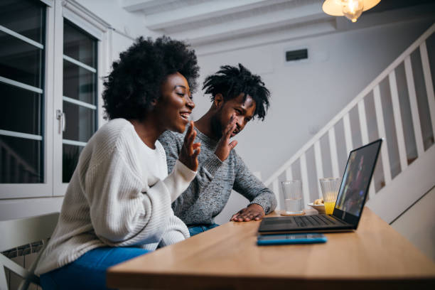 istock Happy couple having a video call 1253196381