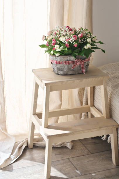 istock Flowers bouquet in basket against curtains 1253199745