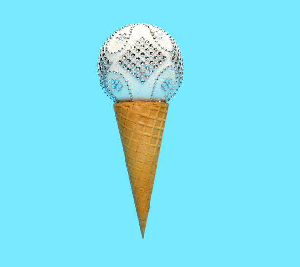 istock ice cream cone with white Christmas decorative ball on top on blue background 1253199783