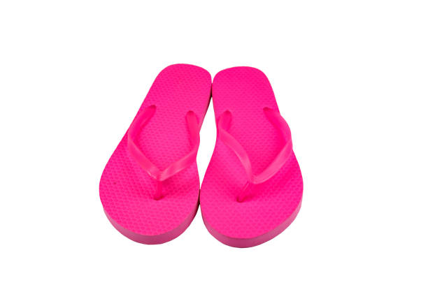 istock Pink flip-flops isolated on white background 1253199814