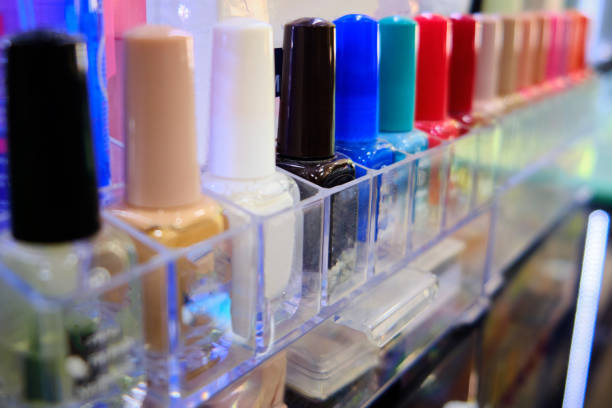istock Row of vials with colored nail polishes 1253202751