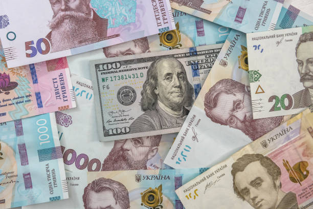 istock money concept exchange. dolla to uah gryvna bills 1253205259
