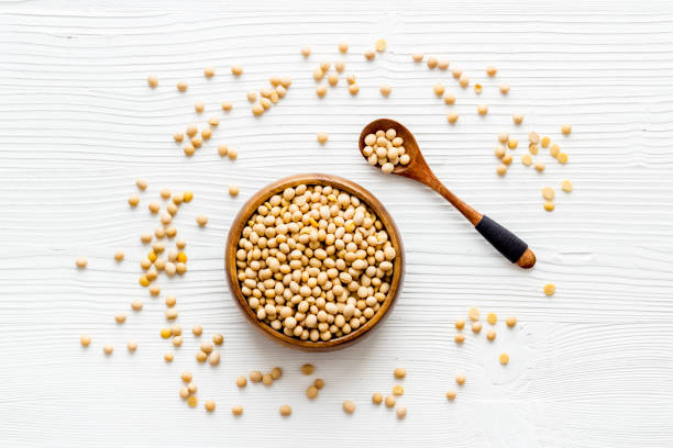 istock soy beans in bowl on white desk top-down 1253206536