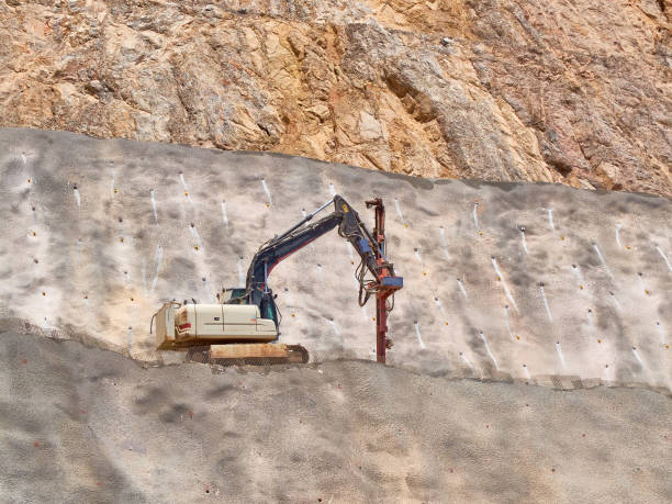 drilling rig on the quarry sledge. blasthole drilling operations - drill borehole mining rock imagens e fotografias de stock