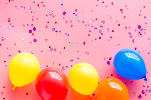 istock Flat lay with ballons - party concept - on pink background top-down copy space 1253207546