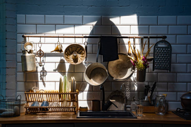 istock vintage kitchen utensils on wall above sink. retro kitchenware. 1253209148