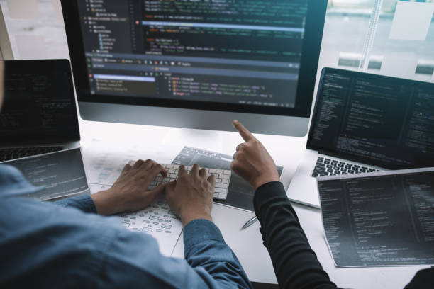 istock Cropped Image Of Colleagues Working In Office 1253211227