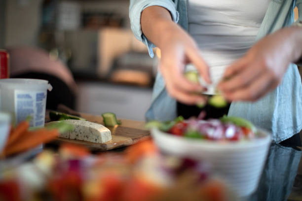 istock Two women having fun in the kitchen while making a healthy meal together for dinner with friends at home. 1253211260