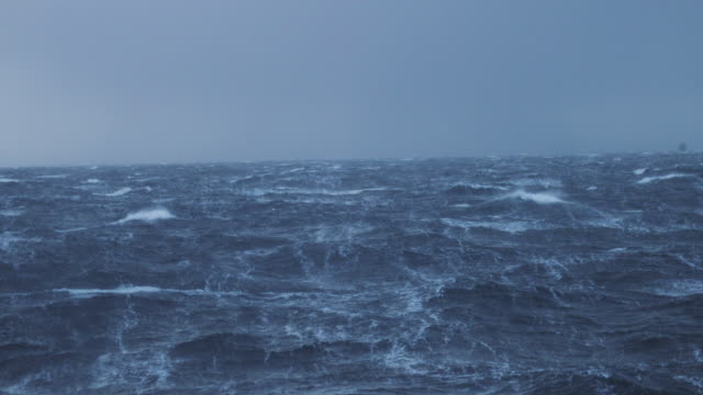 View from a sailing boat of a rough stormy sea: in the ocean during a gale