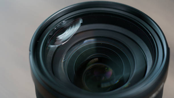 istock Broken mirrorless camera lens glass, accident dropped to the ground. 1253213868