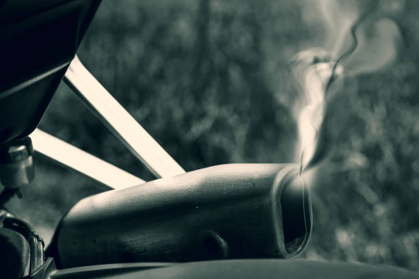 smoke rising from a motorcycle exhaust