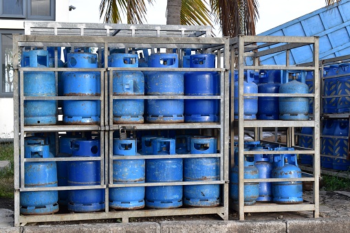 Storage of gas bottles at the back of a gas station. Primary source of energy in households.