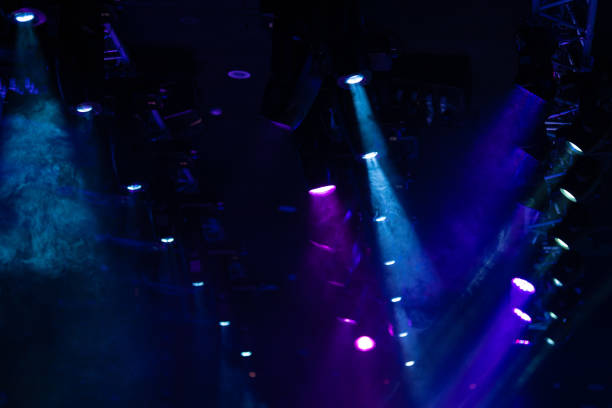 istock stage light with colored spotlights and smoke 1253218266