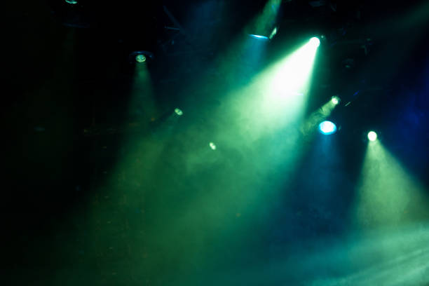 istock lights spotlights and smoke over the stage 1253218318