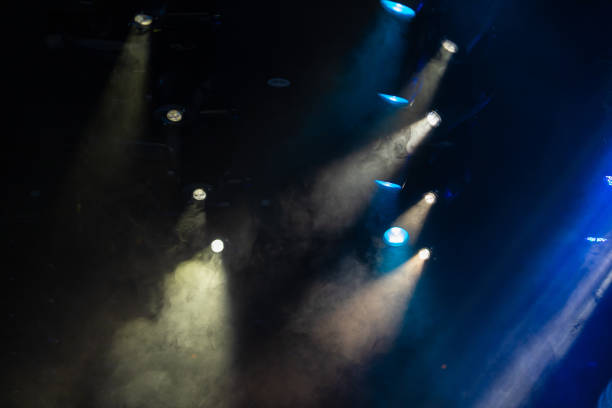 istock lights spotlights and smoke over the stage 1253218409