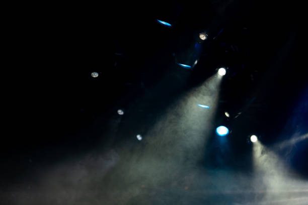 istock stage light with colored spotlights and smoke 1253218443