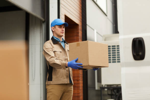Courier carrying parcel stock photo