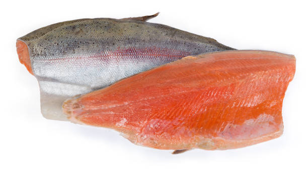 istock Two trout fillet on the skin on a white background 1253220202