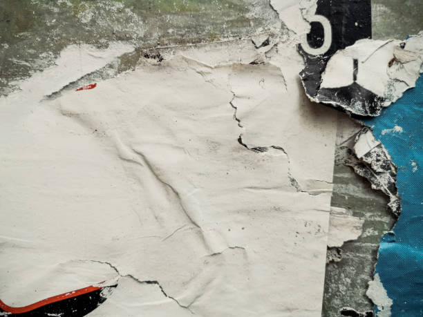 istock Old ripped blank torn grunge posters texture background 1253220781