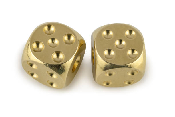 istock Two golden dices closeup isolated on white background. Five and five, with a shadow. View from above. 1253222418