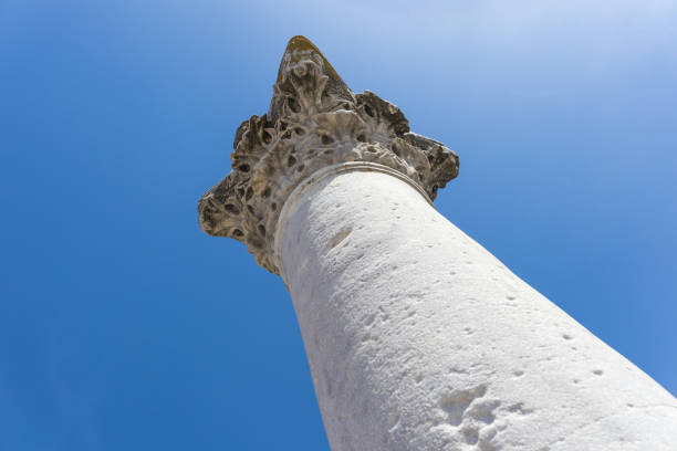 Antique column against the sky. Look up. Travel and tourism concept.