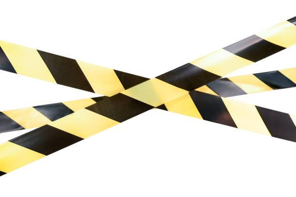 istock Yellow and black boundary tape on a white isolated background 1253224725
