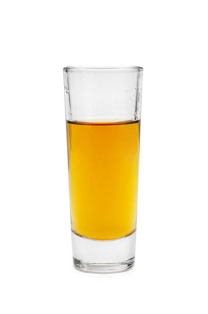istock Whiskey shot glass isolated on white. 1253225304