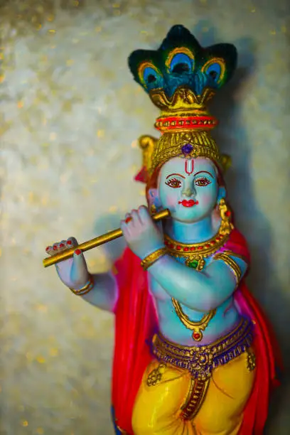 Colorful figure of the Hindu God Krishna playing the flute. Lord Krishna playing the flute.