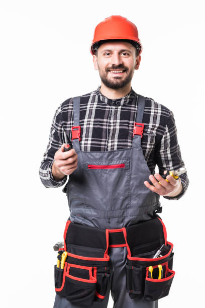istock Handyman holding screwdriver isolated over white background 1253231716