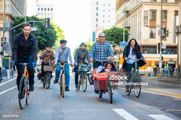 Community Members Riding Together In Carfree Urban Zone Stock Photo - Download Image Now