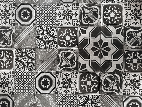 top view shabby ornamental tiles on a floor