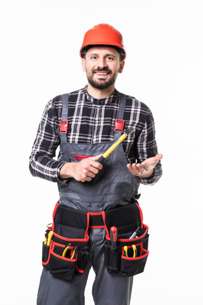 istock Builder with protective gloves holding hammer isolated on white background 1253232918