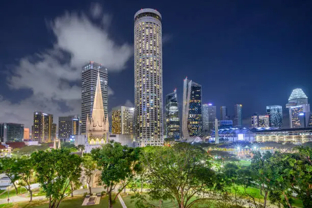 Singapore 01. January 2020 : St. Andrew's Cathedral and Swissôtel The Stamford at night