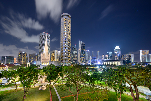 Singapore 01. January 2020 : St. Andrew's Cathedral and Swissôtel The Stamford at night