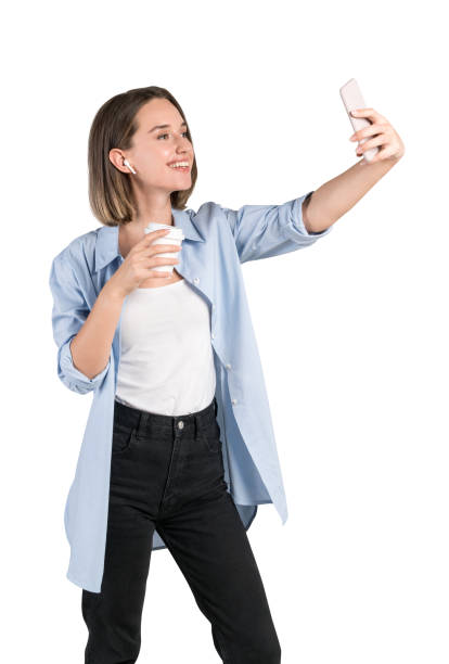 istock Smiling video chatting young woman, isolated 1253236489