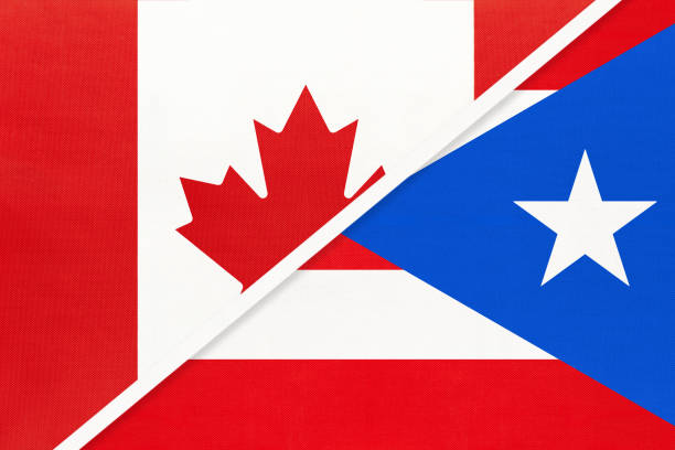 istock Canada and Puerto Rico, symbol of national flags from textile. Championship between two American countries. 1253238509